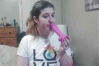 Blowing a dildo 
